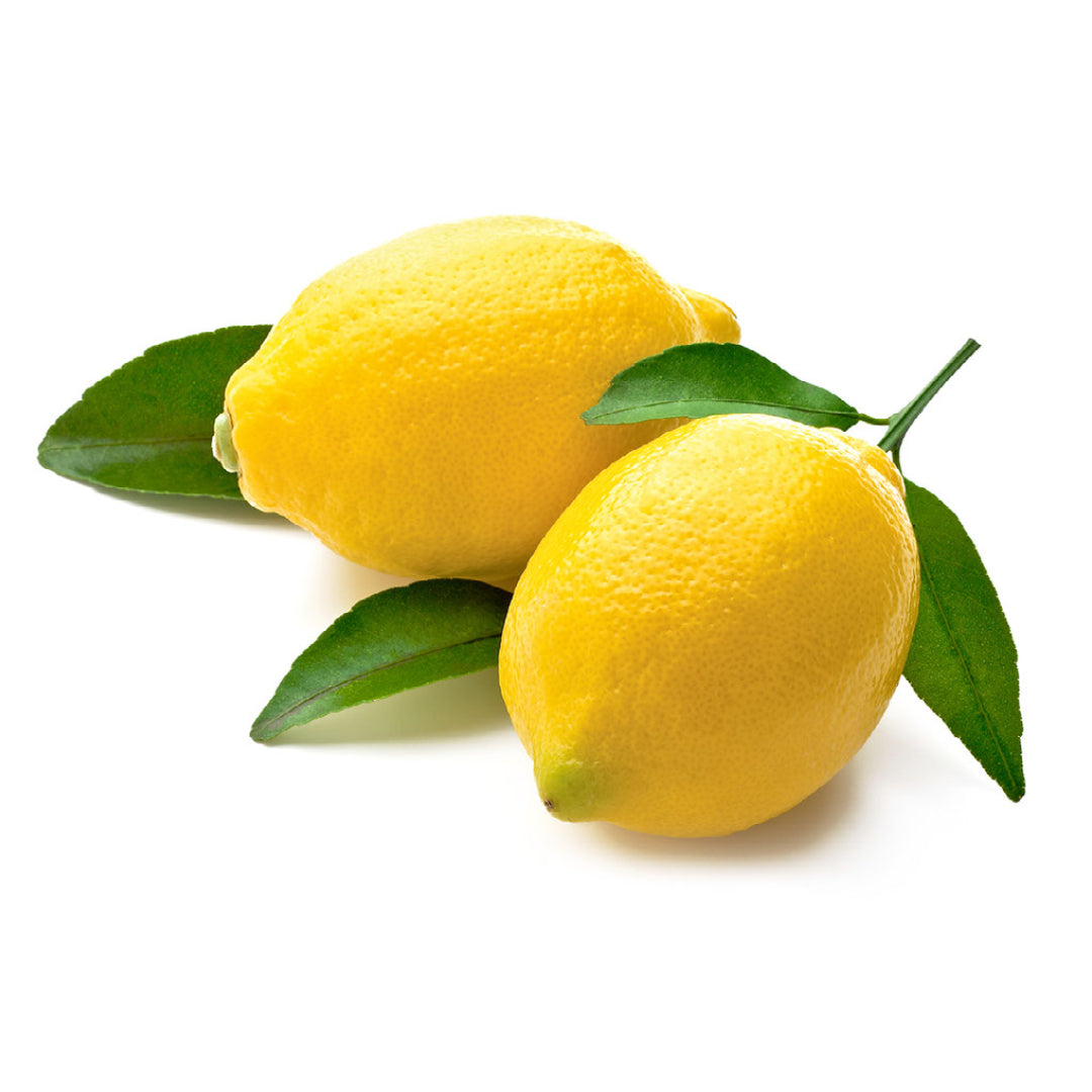 Fresh lemons with some leaves on a white background